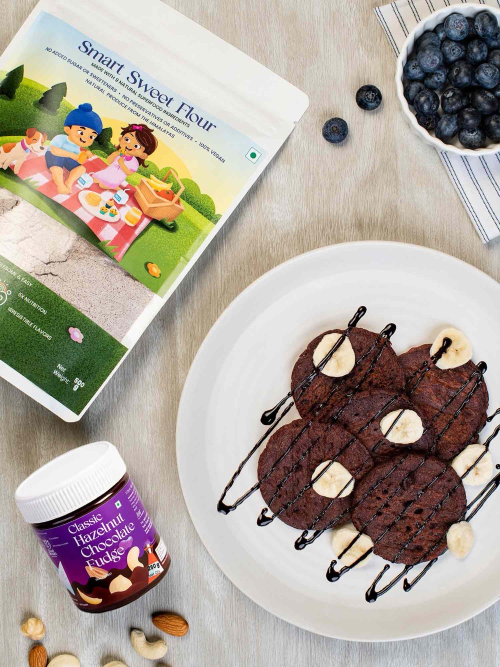 Feed Smart Smart Sweet Flour pack and Hazelnut Chocolate Fudge with chocolate-banana pancakes and blueberries